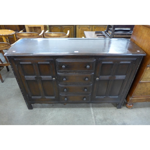 157 - An Ercol Old Colonial dark elm sideboard