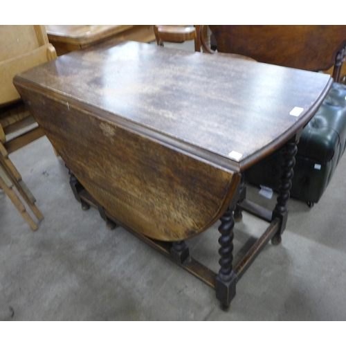 168 - An oak barleytwist gateleg table