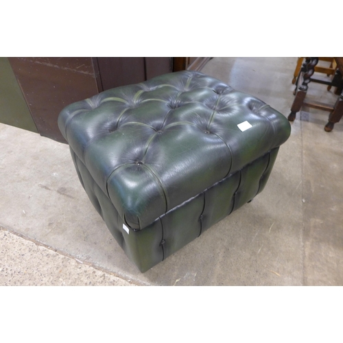 171 - A green leather buttoned pouffe