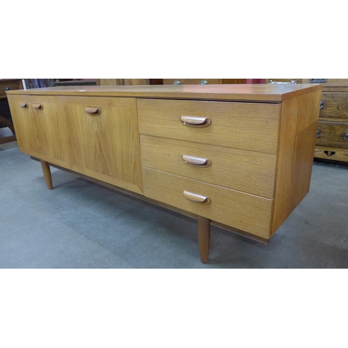 2 - A teak sideboard