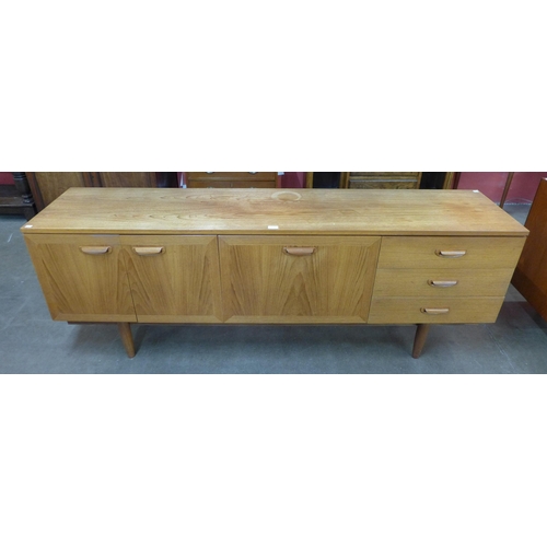 2 - A teak sideboard