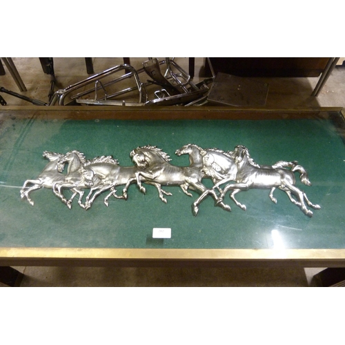 202 - A mahogany and brass mounted coffee table, the top inset with galloping horses