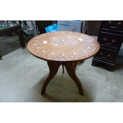 203 - An Indian hardwood and faux ivory inlaid circular occasional table