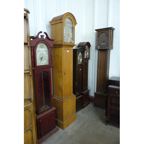 208 - Three mahogany dwarf longcase clocks, an oak longcase clock and an oak longcase clock case