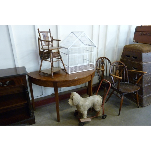 211 - A pair of Ercol fleur de lys dining chairs, a George III mahogany demi-lune hall table, painted bird... 