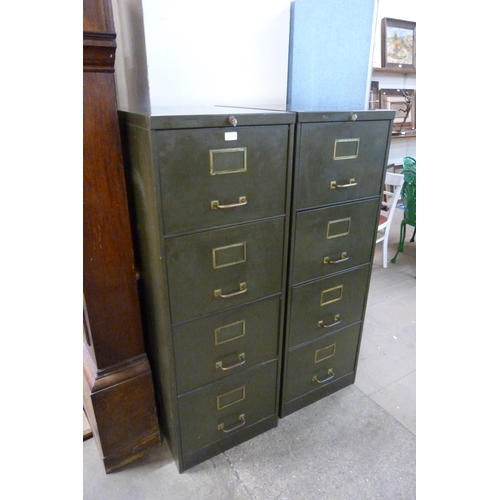 217 - A pair of industrial green metal four drawer filing cabinets