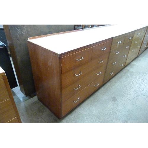 223 - A mid 20th Century teak and Formica topped M.O.D. chest of drawers