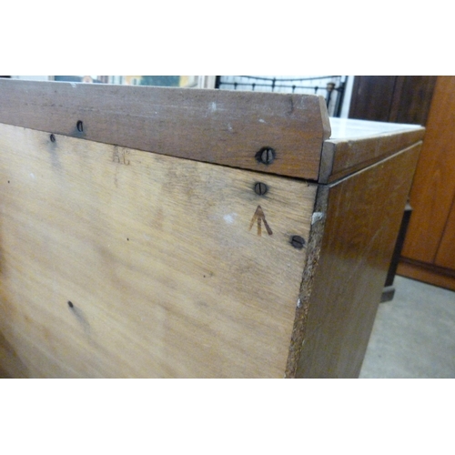 224 - A mid 20th Century teak and Formica topped M.O.D. chest of drawers