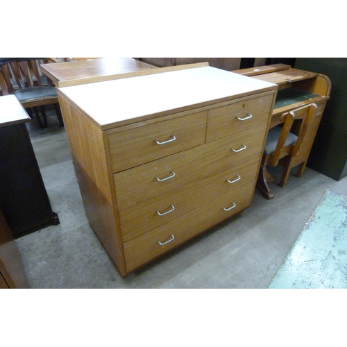 227 - A mid 20th Century teak and Formica topped M.O.D. chest of drawers