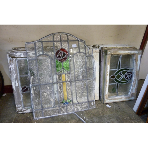 238B - Twelve Art Nouveau stained glass windows and a window pane