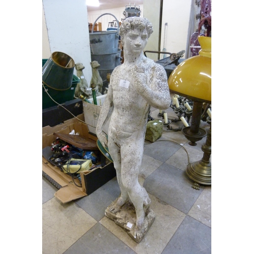 241 - A painted reconstituted stone garden figure of David