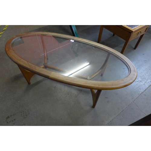 24C - A Stonehill Stateroom teak and glass topped oval coffee table