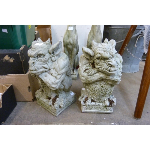 254 - A pair of concrete garden figures of gargoyles