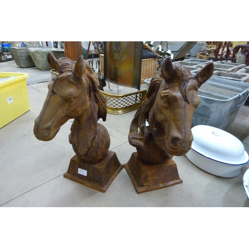 264 - A pair of cast iron horse head garden ornaments