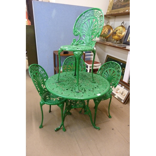 266 - A painted cast alloy garden table and four chairs, one chair a/f