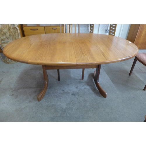 3 - A G-Plan Fresco teak extending dining table and four chairs