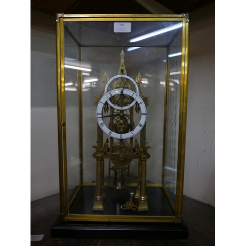 308 - A cased brass fusee skeleton clock