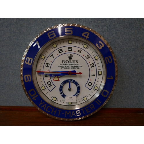 318 - A Rolex style dealer's display wall clock