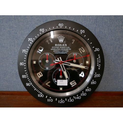 320 - A Rolex style dealer's display wall clock