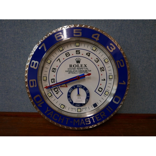 321 - A Rolex style dealer's display wall clock