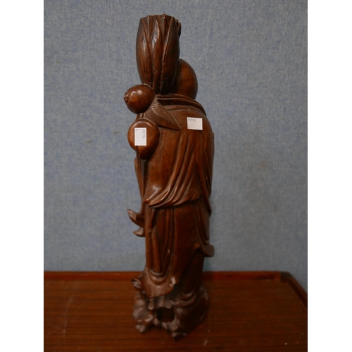 331 - An oriental carved hardwood figural Buddha lamp base