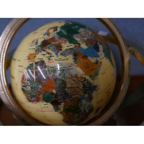 334 - A faux gemstone desk top terrestrial globe on stand