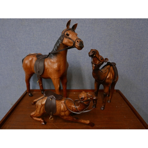 339 - Two leather figures of camels and a horse