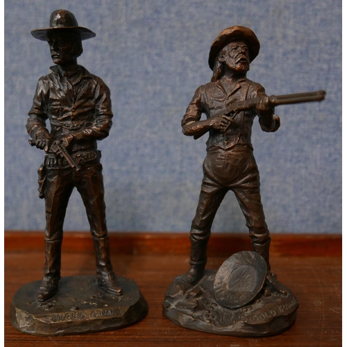 348 - A pair of similar bronze figures of cowboys