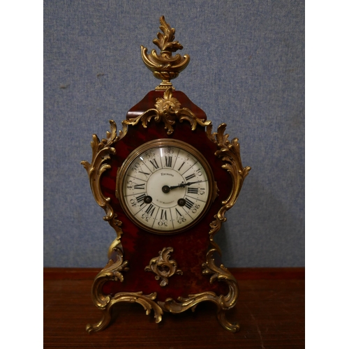 361 - An early 20th Century French faux tortoiseshell and gilt metal mounted mantel clock