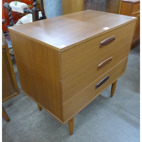 64 - A teak chest of drawers