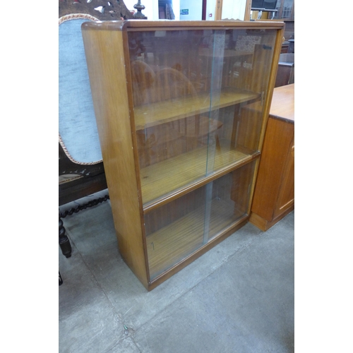 65 - A B&S Goodwin Ltd. of London walnut Roseberry bookcase