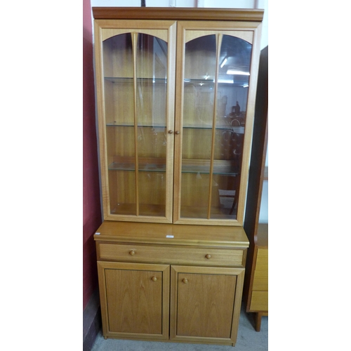 69 - A teak display cabinet