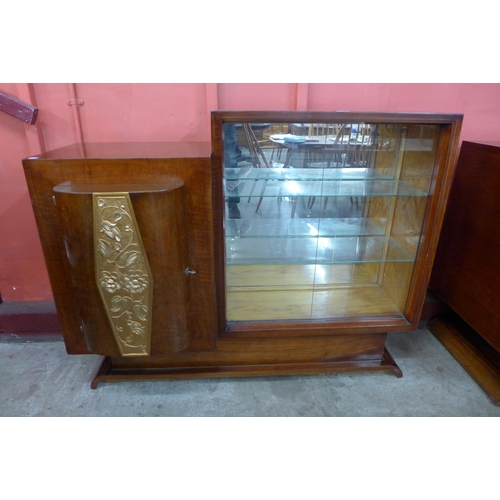 73 - An Art Deco walnut and parcel gilt side cabinet, 102cms h, 129cms w, 50cms d