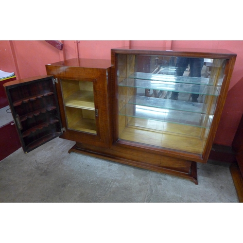 73 - An Art Deco walnut and parcel gilt side cabinet, 102cms h, 129cms w, 50cms d