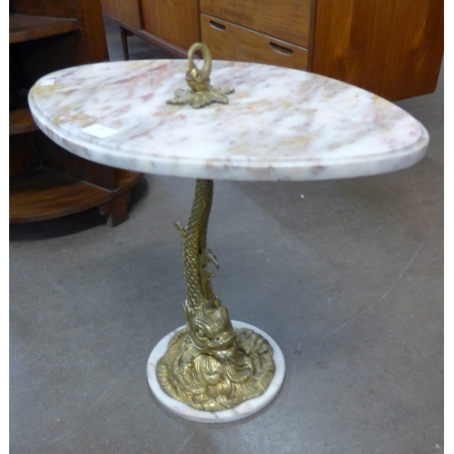 83 - An Italian brass dolphin based and marble topped wine table