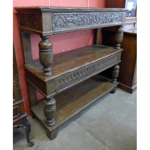 90 - A Charles II Welsh carved oak three tier buffet