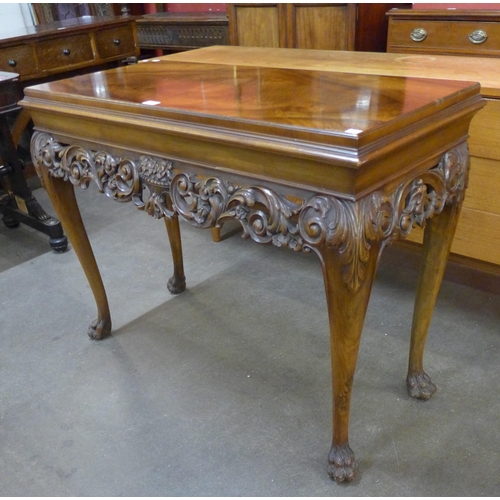 96 - An Italian Rococo style carved walnut console table