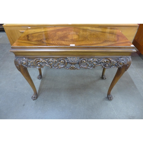 96 - An Italian Rococo style carved walnut console table