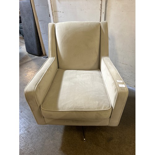 1501 - A sandstone velvet upholstered swivel side chair