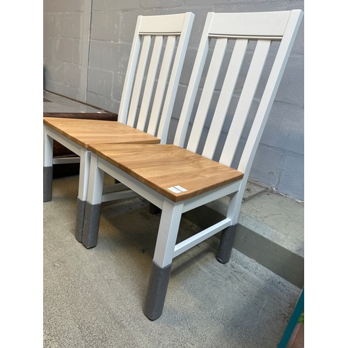 1603 - A pair of white painted and oak dining chairs