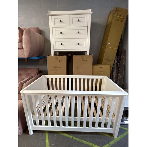 1522 - A Silver Cross white painted cot bed and two over three chest of drawers