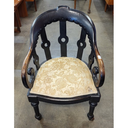 81 - A Victorian Gothic Revival elm library chair