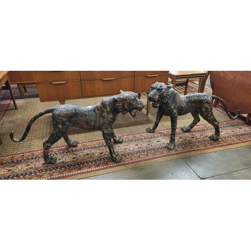 368 - A pair of large oriental bronze figures of tigers, 60cms h x 113cms l