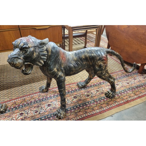 368 - A pair of large oriental bronze figures of tigers, 60cms h x 113cms l