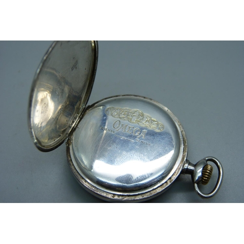 1052 - A .900 silver Omega pocket watch, case stamped Omega, movement stamped Omega, 15 jewels, adjusts to ... 