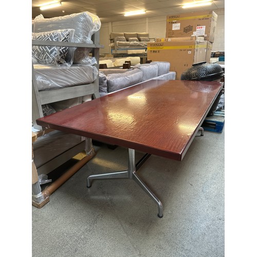 1594 - A rosewood effect dining table with metal base