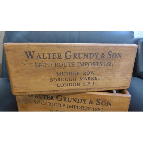 1306 - A set of three stacking 'Walter Grundy & Son' storage boxes