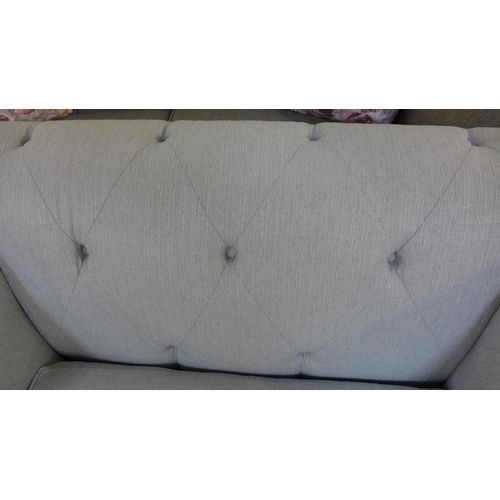 1309 - A light grey textured weave Chesterfield style love seat