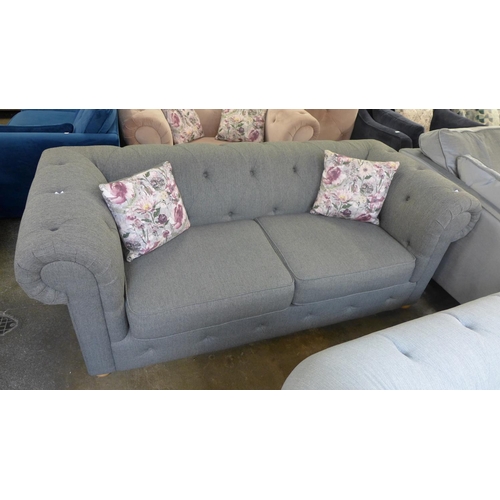 1309 - A light grey textured weave Chesterfield style love seat