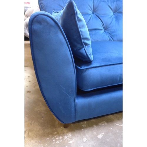 1310 - A Hoxton blue velvet three seater sofa RRP £799